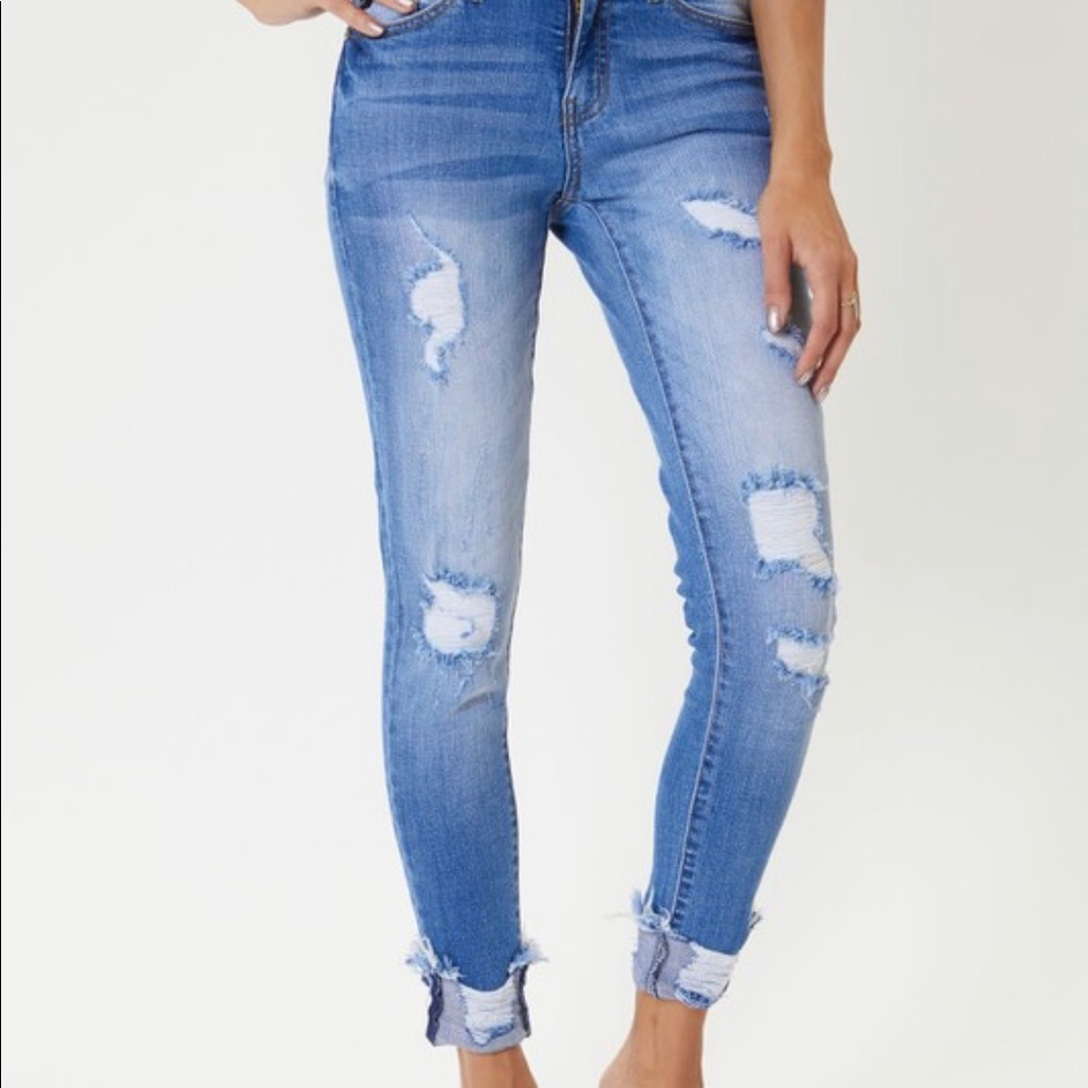 Light wash distressed jeans can be cuffed